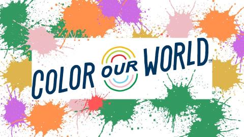 The text "Color Our World" is on a paint-splattered background featuring multiple colors. 
